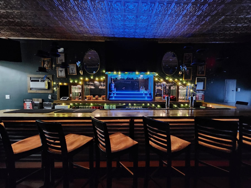 Darkhorse Tavern interior bar shot with bar top and liquor in the background